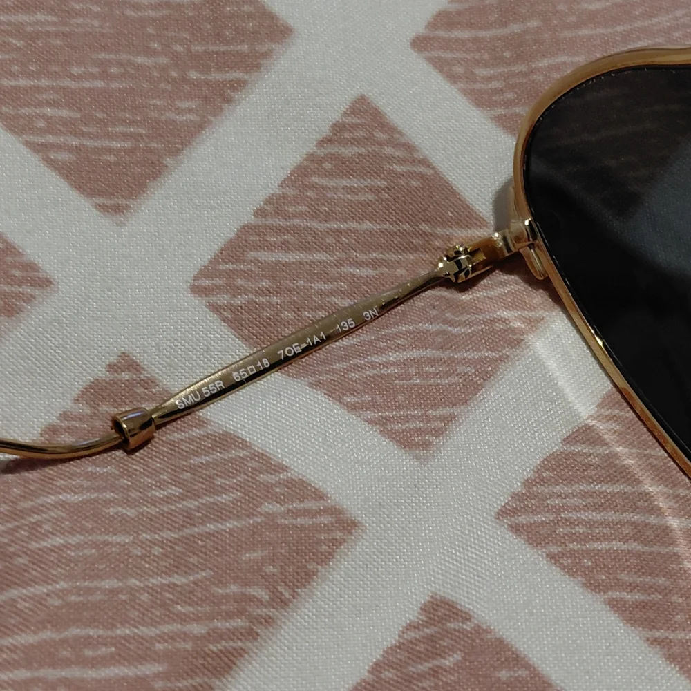 Miu Miu Gold Frame Sunglasses with Black Lenses